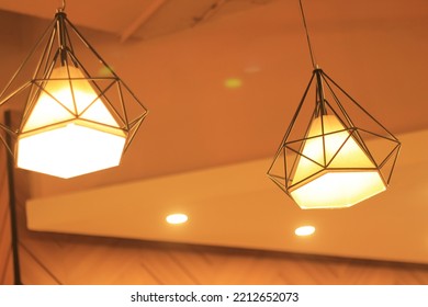 yellow light with a unique style decorated with hexagon wire. - Shutterstock ID 2212652073