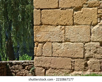 Yellow Limestone Wall With High Water Mark                              