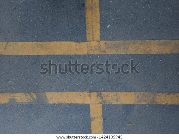 Yellow line dividing\
traffic lanes.a division of a road marked off with painted lines\
and intended to separate single lines of traffic according to speed\
or direction.