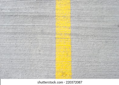 Yellow line on concrete.