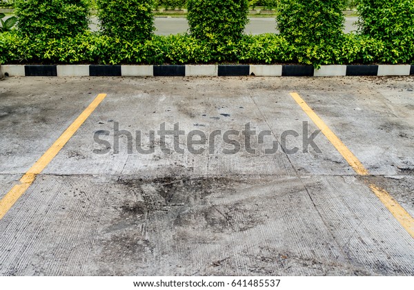 Yellow line on concrete car\
park