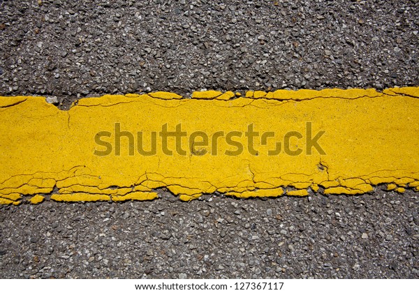 yellow\
line, texture of yellow street line dividing\
road