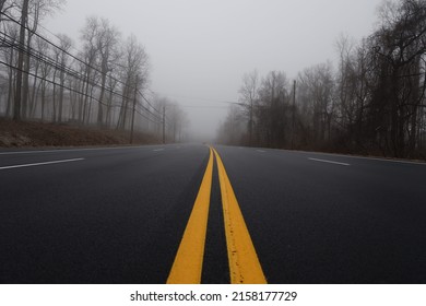The yellow lines on the smooth asphalt road  - Shutterstock ID 2158177729