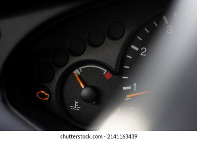 Yellow Lit Engine Error Sign On Car Dashboard Close Up