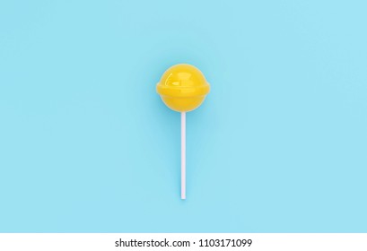yellow lolipop on blue pastel background. sweet candy concept
