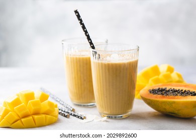 Yellow Mango Papaya Smoothie In Glass. Tasty Mango Lassi