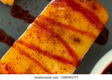 Yellow Mango Popsicle With Tajin Sauce