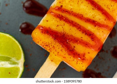 Yellow Mango Popsicle With Tajin Sauce