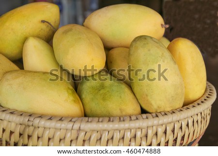 Yellow mangoes in a basket, Philippines