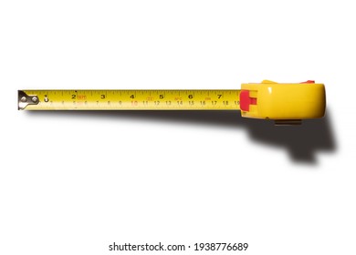 Yellow measuring tape isolated, cut out on white background. Top view.