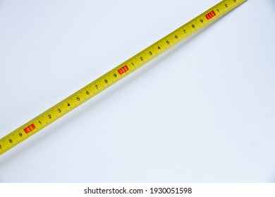 yellow measuring tape on a white background tape in centimeters