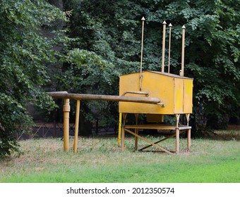 Yellow Metal Box Of A Gas Distributor In A Green Garden