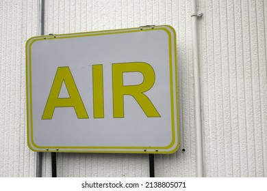 Yellow Metal Sign Advertising Air