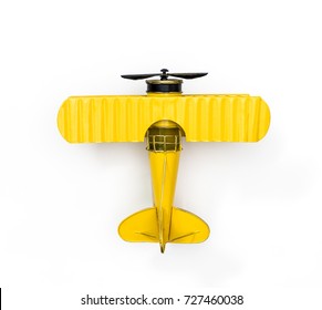 Yellow Metal toy vintage plane isolated on white for Children Fun Air Travel concept Top view Flat lay - Powered by Shutterstock