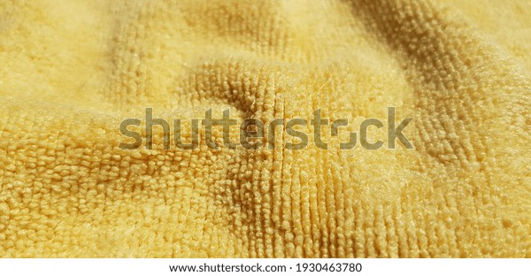 Yellow micro fiber in\
folds (texture).