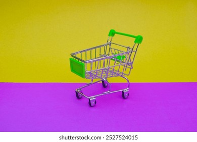 yellow Mini shopping trolley, shopping cart side view trolley red colour on white background | E-commerce supermarket trolley side view with yellow and pink and two - Powered by Shutterstock