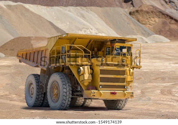 Yellow mining truck\
in iron ore in Austria.