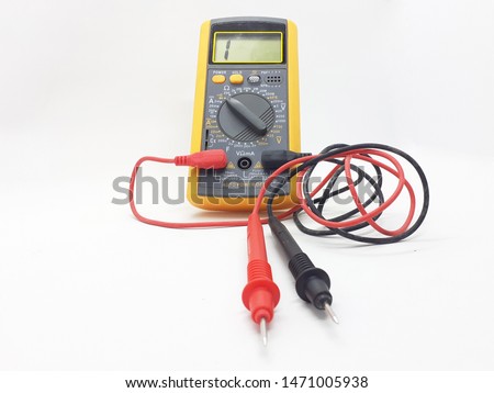 Yellow Modern Digital Electronic Multi Meter with Ohm Ampere Volt and Watt Measurement with Red and Black Probe in White Isolated Background