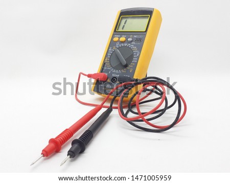 Yellow Modern Digital Electronic Multi Meter with Ohm Ampere Volt and Watt Measurement with Red and Black Probe in White Isolated Background
