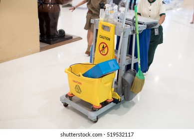 Yellow Mop Bucket And Set Of Cleaning Equipment 