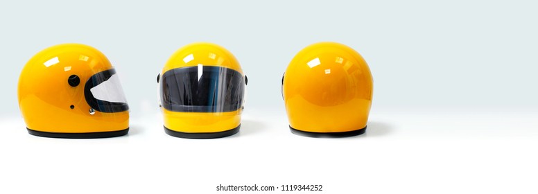 Yellow motorcycle helmet on a white background, front, back, side