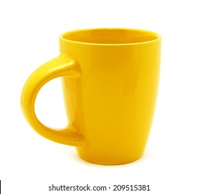 Yellow mug empty blank for coffee or tea isolated on white background