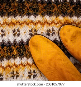 Yellow Mustard Boots On Warm Winter Knit Sweater Background. Fashionable Warm Winter Flatlay.