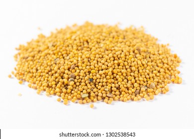 Yellow Mustard Seeds On White Background