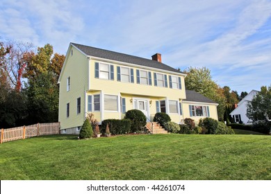 Yellow New England Style Colonial House