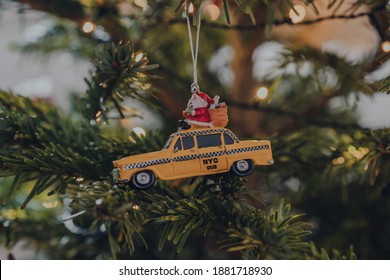 Yellow New York Taxi Christmas Decoration On A Christmas Tree, Shallow Focus, Bokeh.