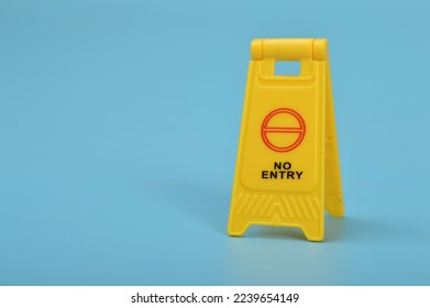 Yellow No Entry sign isolated on a blue background. - Shutterstock ID 2239654149