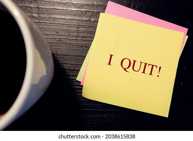 Yellow Note On Coffee Table Written I QUIT , Concept Of Decision Making To Stop Behaviors, Give Up Or Leave Permanently. Quit Job, Relationship, Addiction Or Bad Habits
