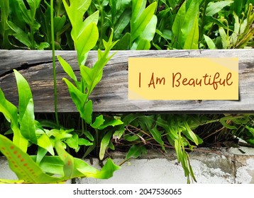 Yellow Note On Wood With Text I AM BEAUTIFUL, Self-love Affirmation To Boost Self Esteem, Overcome Negative Thoughts, Anxiety, Stress, Loneliness, Depression And Bad Relationship With Positive Mantra