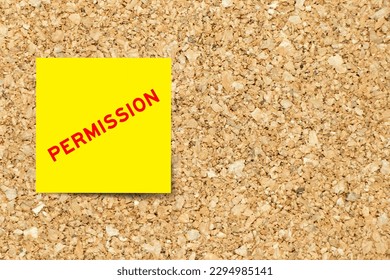 Yellow note paper with word permission on cork board background with copy space - Shutterstock ID 2294985141