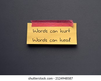 Yellow note stick on blue background with text Words can hurt Words can heal - to remind language have power to harm or heal - word choice matters most so choose wisely