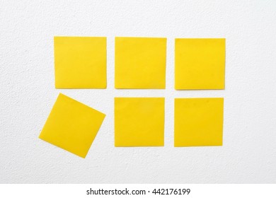 yellow notes on a wall
