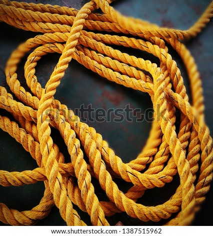 Yellow nylon rope. Rope made of nylon is most appreciated because it is very stretchy.