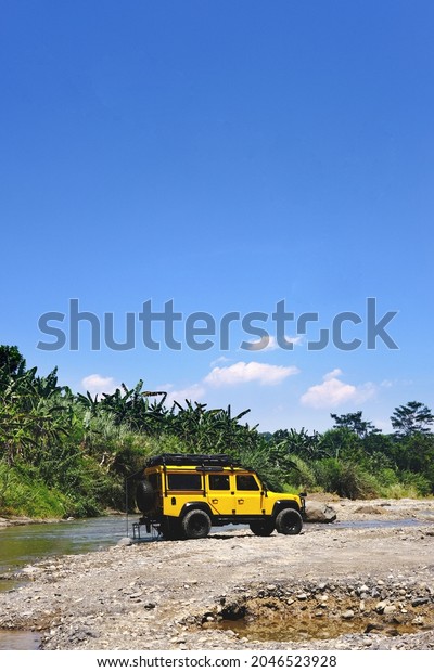 yellow offroad cars\
adventure in the stream