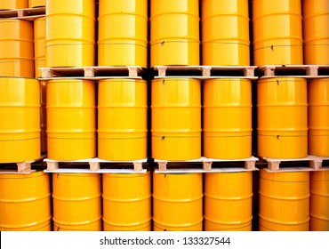 Yellow oil drums on an industrial transport site