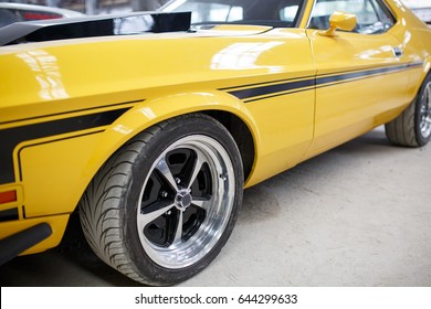 Yellow Old Muscle Car With Alloy Wheel Indoor.