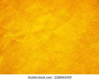 Yellow old velvet fabric texture used as background. Empty golden fabric background of soft and smooth textile material. There is space for text.	