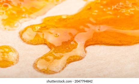 Yellow Orange Drops Of Cannabis Wax Close Up,high Thc Dab Resin.