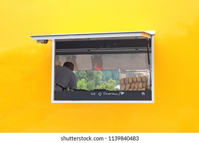 Yellow And Orange Food Truck With A Window And The Text 