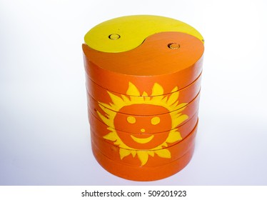 Yellow And Orange Yin And Yang Wooden Puzzle With Sun 