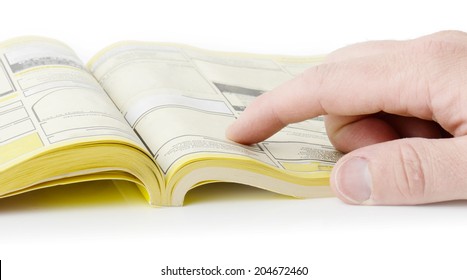 yellow pages searching with finger, blank spaces for text input. all information burred 
