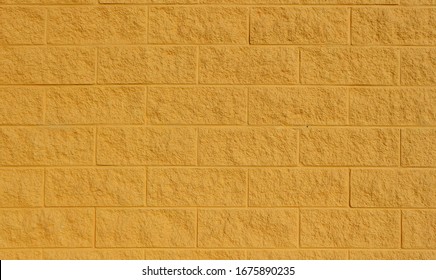 Yellow Painted Cinder Block Wall. Background And Texture, Close Up