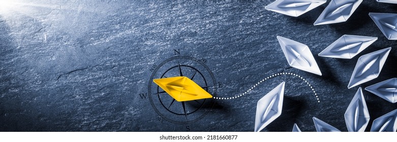 Yellow Paper Boat With Compass Leaving Group And Changing Direction - Entrepreneur - Business Opportunity - Shutterstock ID 2181660877