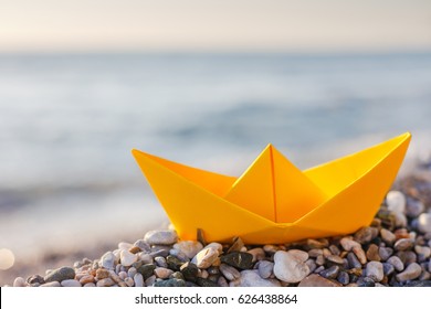 Yellow Paper Boat On The Beach