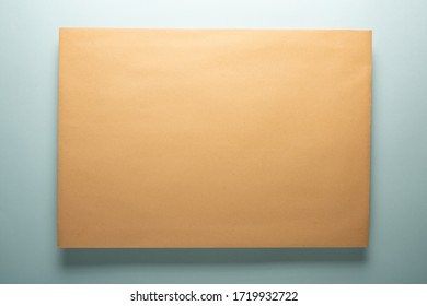 Yellow paper envelope with shadow. Paper texture