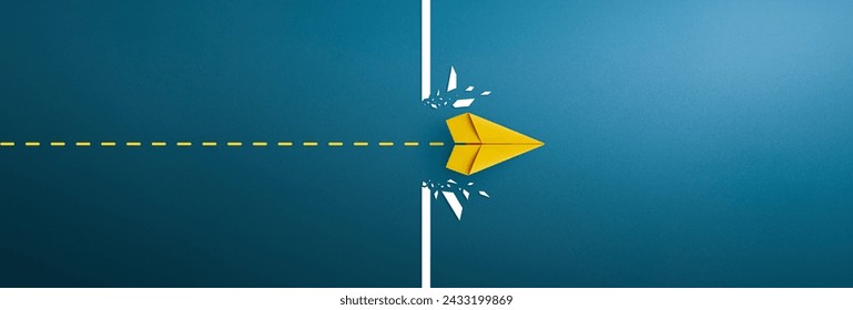 Yellow paper plane breaking through obstacle, Concept of overcoming barriers, goal, target. copy space